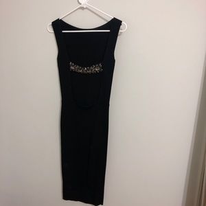 Zara Knit black tight fitting open back dress.